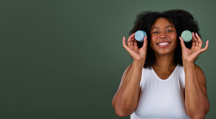 holding up shampoo and conditioner bar