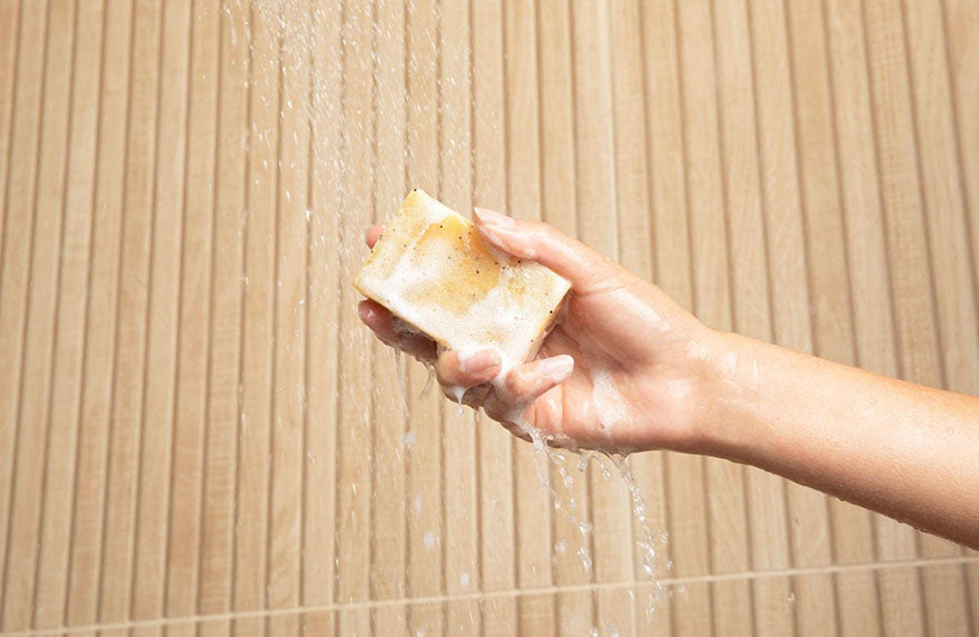 soap bar under shower water